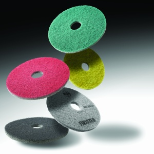 Abrasives where abrasive material is sprayed onto a nylon pad are used for maintenance and light restoration.