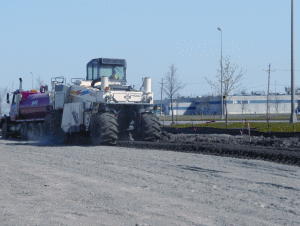 Midstate used a Wirtgen 2500 reclaimer to blend a cement additive and water with the soft soil to stabilize the parking area of the project.
