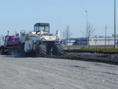 Midstate used a Wirtgen 2500 reclaimer to blend a cement additive and water with the soft soil to stabilize the parking area of the project.
