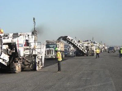 By using Topcon GPS, Intercounty Paving Associates was able to simultaneously operate five Roadtec RX-900 milling machines to speed production at the John F. Kennedy Airport. This would have been impossible using conventional techniques.