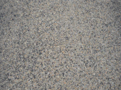 A close-up of the highway's three-course surface treatment that included the use of CRS-2P, a cationic rapid setting type of emulsified asphalt modified with the addition of polymers, and expanded clay lightweight aggregate (LWA).