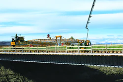 Graham Group Ltd.’s new GOMACO C-450 finisher with transitional framework was put to work right away on Highway 2 just north of Calgary. The project involved placement of 620 cu. yds. of silica-fume concrete on side-by-side bridges.