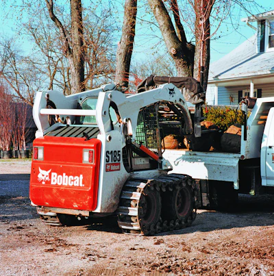 Application and ground conditions will determine whether a skid-steer equipped with tracks or a compact track loader would be the best option.