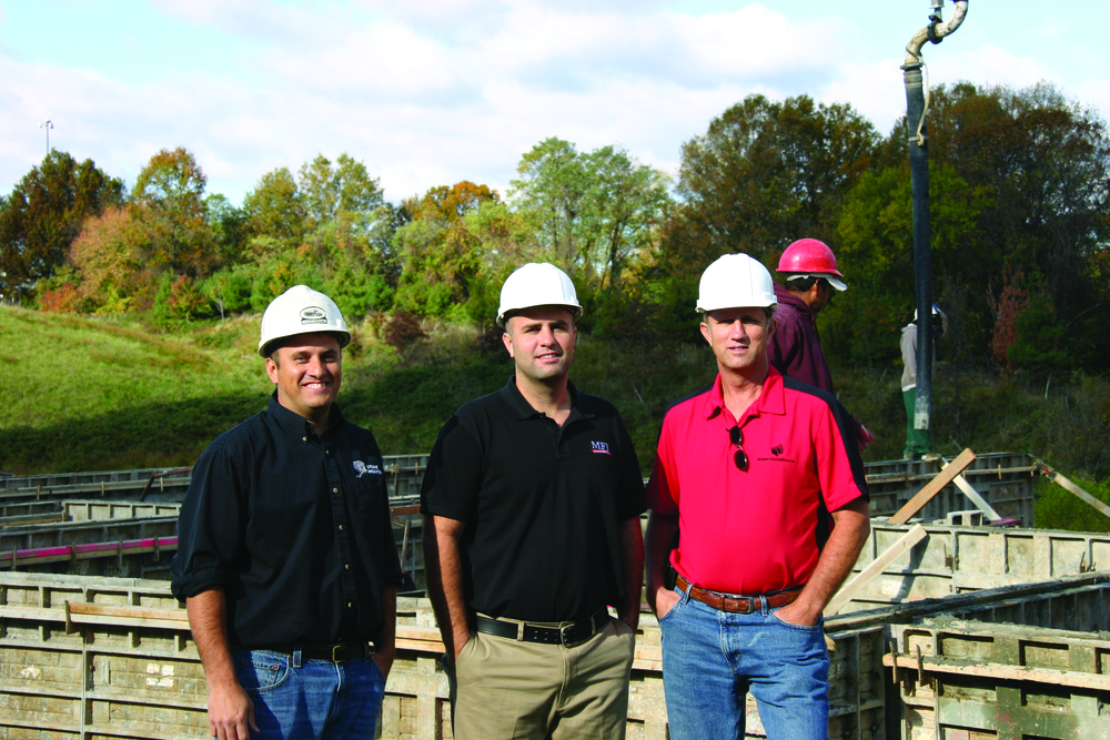 Bruce Neale, right, president and CEO of Modern Foundations, on site with his sons Mike Neale, middle, president of MFI Concrete, and Jason Neale, left, president of Stone Shooters, Inc.