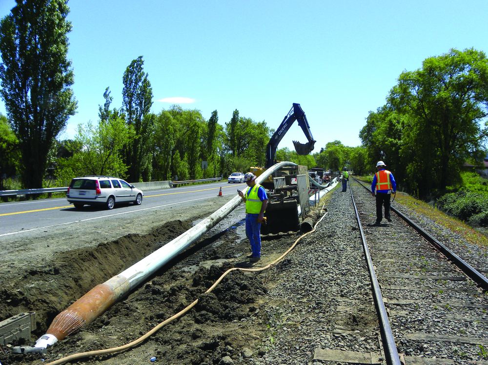 Pipe bursting allows new pipe to be installed with minimal disruption to the surrounding area. Here, Team Ghilotti uses a TT Technologies Grundoburst system to pull back new 12-in. C-900 fusible PVC pipe in St. Helena, CA.