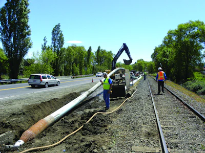 Pipe bursting allows new pipe to be installed with minimal disruption to the surrounding area. Here, Team Ghilotti uses a TT Technologies Grundoburst system to pull back new 12-in. C-900 fusible PVC pipe in St. Helena, CA.