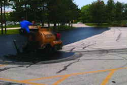 The parking lots were sealed using two SealMaster SP 300 squeegee machines which Sonnenberg outfitted with custom-made 18- to 24-in. brooms on the back of the units.