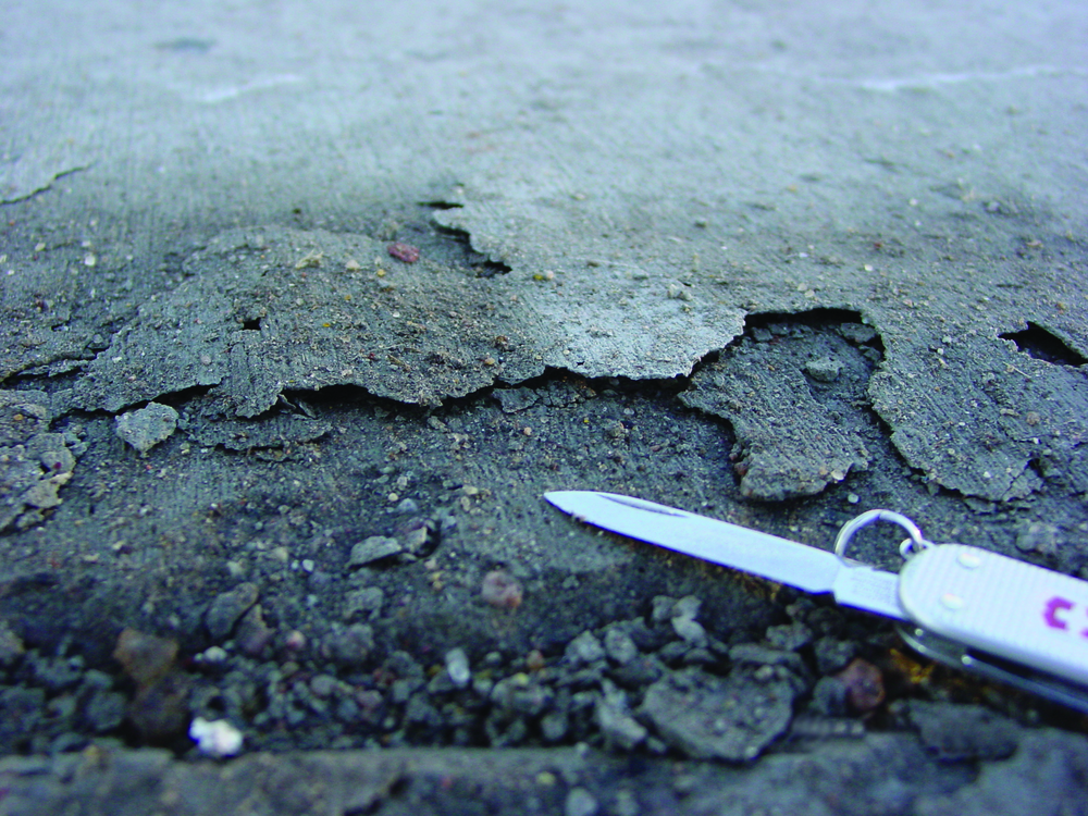 Scaling, above, and premature surface wear typically occur when contractors mix bleedwater into the surface or trap bleedwater and air directly beneath the surface.