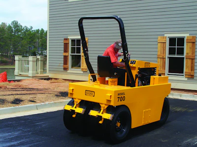 When completing chipseal projects, pneumatic rollers will set the aggregate in the oil without breaking the edges of the rock. Courtesy Basic Equipment, www.basicequipment.net.