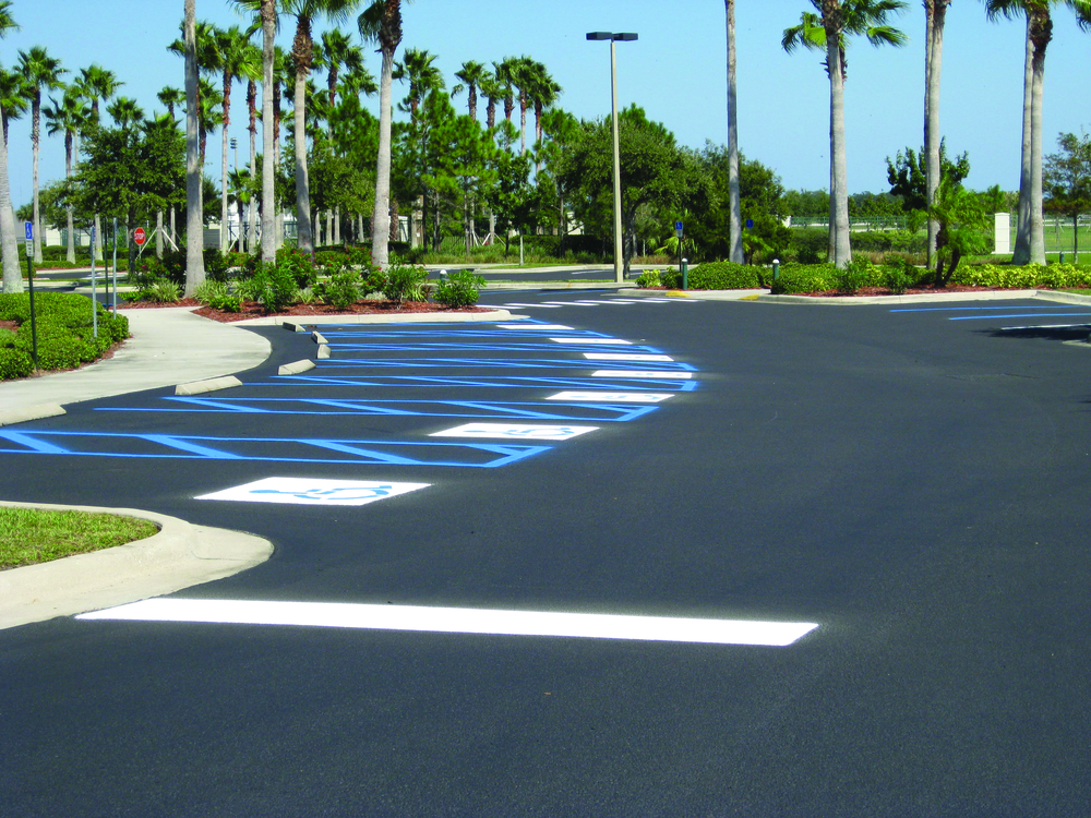 Because it was a government job, Robert had to restripe the handicap stalls exactly as they were with several different designs on each parking lot. Photo documentation was used to ensure proper painting.
