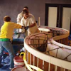 The crew at the Decorative Concrete Institute had to manually place concrete into a countertop form after a pump mishap.