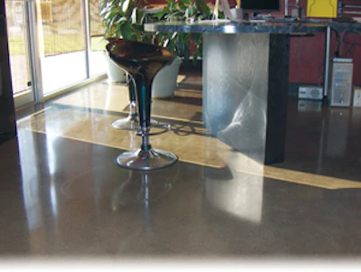 The office space at CONCRETEWORKS Design features polished floors, acid stained with densifiers and water-based finish coats.