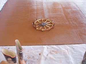 Recycling artists utilize materials that might otherwise end up in the landfill. We did some recycling art of our own by embedding a sprocket we found on our property in fresh concrete prior to polishing.
