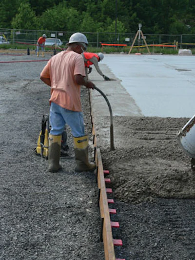 With all plate dowel systems, it is important that workers properly place and consolidate concrete around and especially under the leave-in-place pocket formers and plate dowels using internal vibrators. Otherwise, plate dowels can break out of the concrete from the top or bottom of the slab.