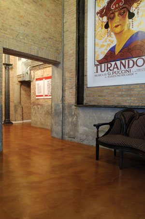 Instead of ripping out and replacing the 80-year-old concrete floor during the lobby renovation at the Opera Lofts condominiums, the general contractor chose a repair and wear topping system with a decorative finish.
