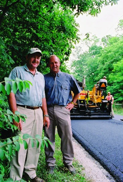 Triangle Asphalt Paving's edge in the market is that brothers Steve (left) and John Day are owners who work in the field.