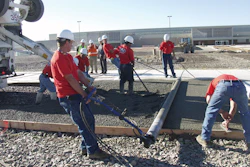 A pervious concrete pavement placement works like an assembly line, says Dale Fisher, with crew members working the ready-mixed truck's chute, members working the screed, and others following with finishing tools.