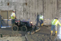 A Lindsay Lampasona crew uses a Somero Power Rake to verify subgrade tolerance before striking off a 20,000-square-foot floor at a Walmart in North Smithfield, R.I.