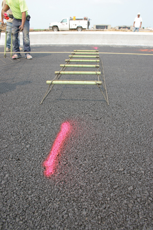 With little or no fine material, the 'popcorn' mix for the open drainage layer allows water to flow away from the concrete pavement.