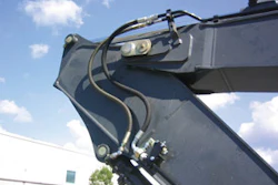 Always be careful about hose line routing. Note how the stick hoses on this HKX auxiliary kit follow factory lines to reduce wear.