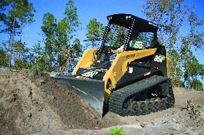 A compact track loader's tractive ability makes it well suited for use with ground-engaging attachments, such as dozer blades.