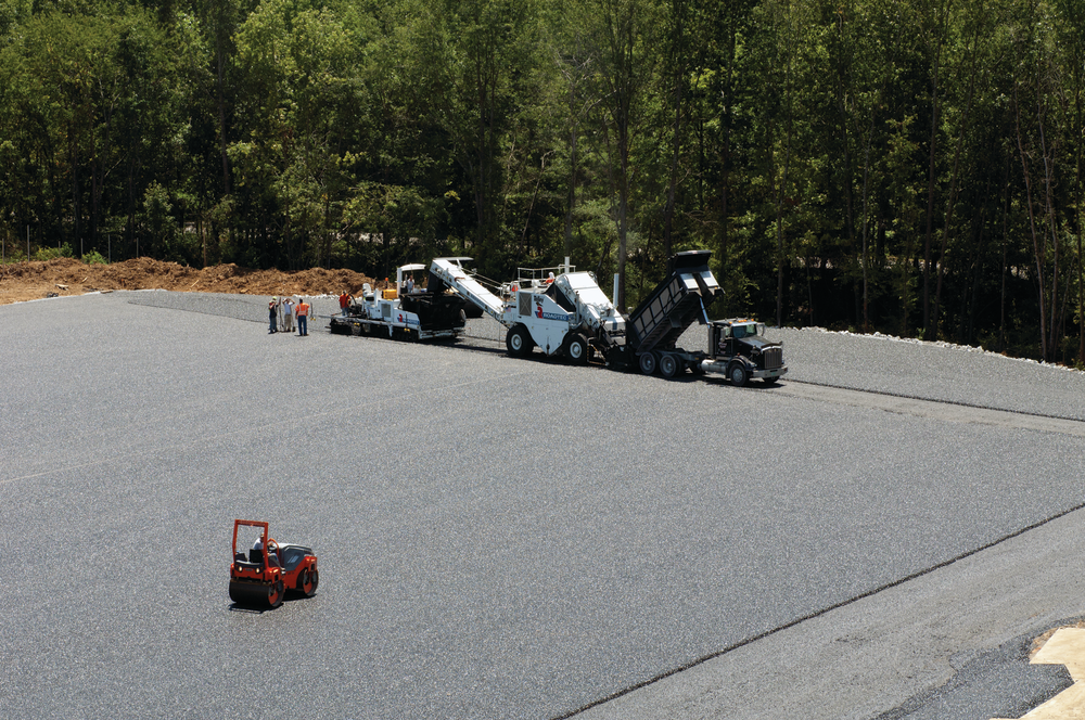The asphalt was applied in two 4-inch lifts of AS binder containing 10% RAP. The layers were capped with 1.25 inches of Open Graded Friction Course (OGFC) surrounded by riprap.