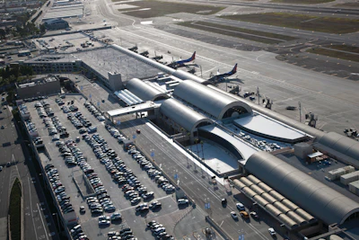 An aerial view of the new 280,000-square-foot John Wayne Airport Terminal C with six bridged aircraft gates, two of which connect to Federal Inspection Services (FIS) (Customs) facilities for international flights and two new commuter terminals.