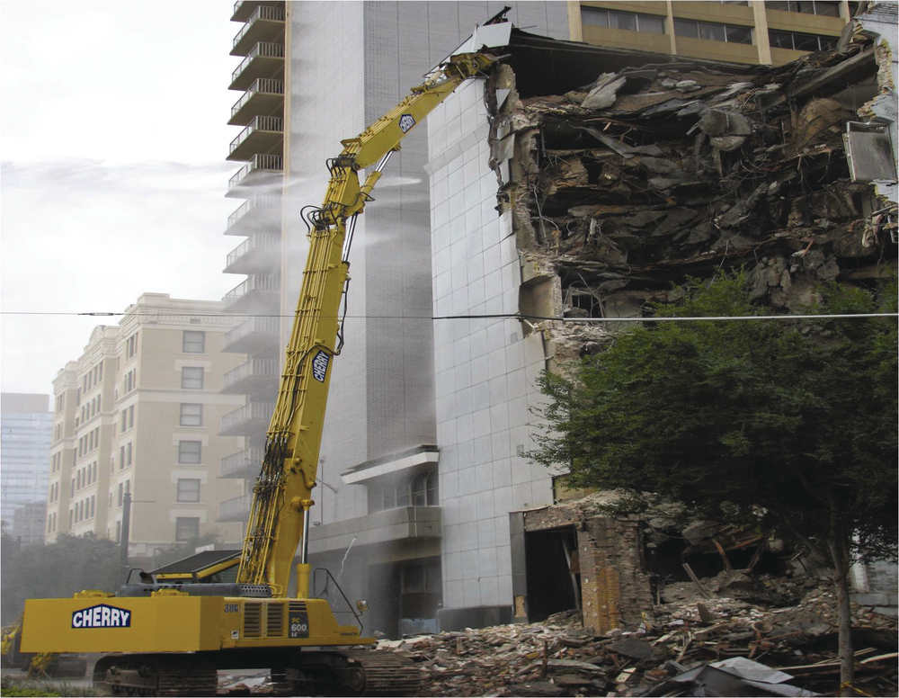 Cherry Demolition had to demolished the 7-story Savoy Hotel in Houston without damaging the nearby buildings and minimizing impact to Main Street infront of the demolition site.