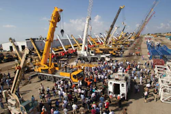 A large crowd gathers around a 2008 Liebherr LTM1160-51 160-ton all terrain crane at Ritchie Bros. Orlando auction in February 2011.
