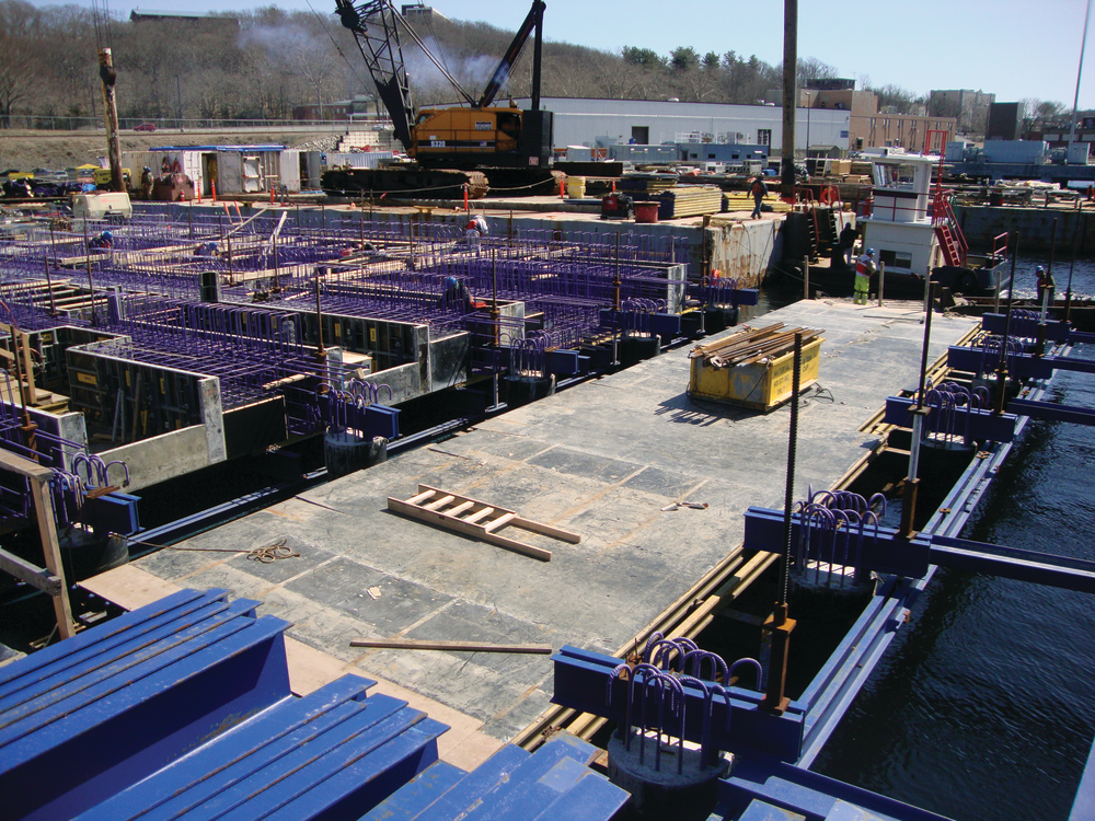 The pier is constructed of a complex honeycombed cast-in-place concrete substructure of pile caps, duct banks and mechanical chases and will be topped with a cast-in-place concrete deck.