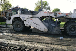 After milling off 3-4 inches of the existing surface, Midwest Stabilization used a Wirtgen 2400 reclaimer to till the cement into the surface.