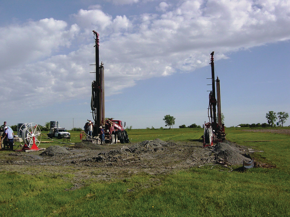 Drilling rigs, like these used for the closed-loop system installed at Lake Land College in Illinois, drill loop fields typically 100 to 300 feet deep.