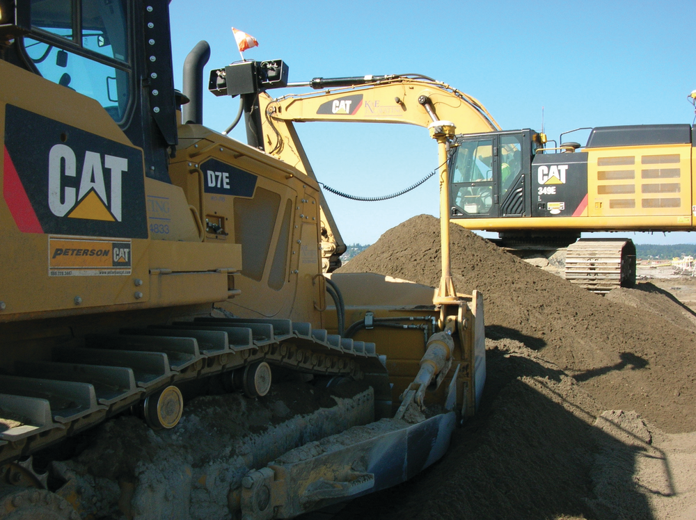 K&E Excavating’s D7E uses half the fuel of the company’s previous model. The company owns 115 pieces of Cat equipment, including the D7E and a 349E (shown working in the background).