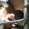 To repair a concrete culvert on a mountainside, the contractor sent an apparatus down the pipe on a sled to the exit of the pipe where the material was then sent through the hose and shot out at 360 degrees to cover the entire pipe.