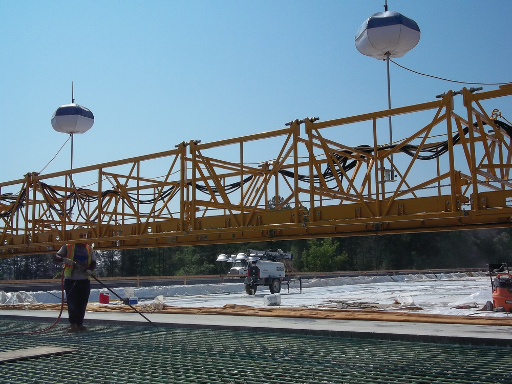 Balloon lights can be mounted to construction equipment and offer glare-free, diffused light that moves along with the equipment operator while traditional light towers offer more light coverage with four adjustable non-diffused lights.