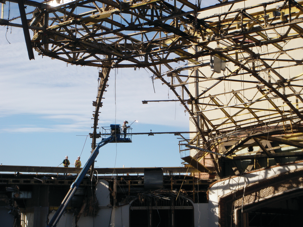 The dome's roofing materials - a compilation of over 16 inches of lightweight concrete, foam insulation, built-up roofing material and thin copper sheeting - were removed manually.