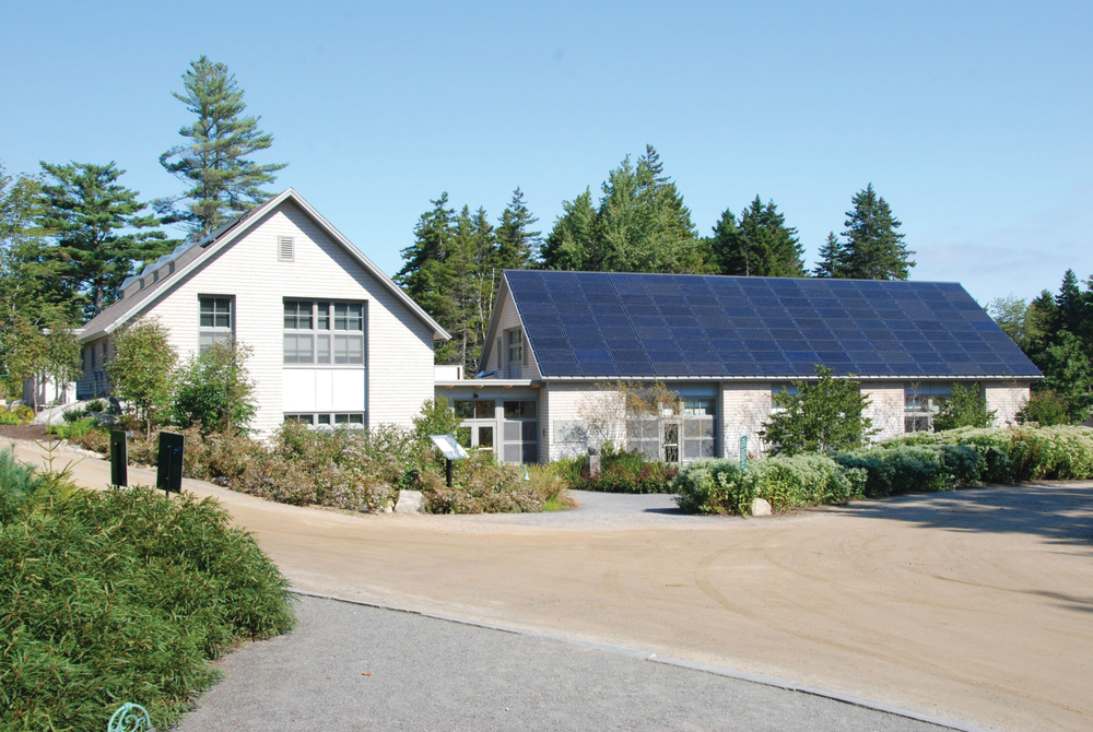 The Coastal Maine Botanical Gardens Bosarge Family Education Center produces almost 30% more energy than it is uses with 135 photovoltaic panels mounted on the south-facing roof, and an additional 102-panel array in a nearby field.