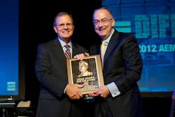 Sam Allen, Chairman and Chief Executive Officer, Deere & Company, accepts the AEM Hall of Fame plaque from Rusty Fowler, 2012 Chair of the AEM and CEO of Krone, North America