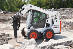 Most manufacturers offer special attachment kits. This Bobcat S570 is equipped with a hydraulic breaker attachment and enclosed cab to protect the operator from debris.