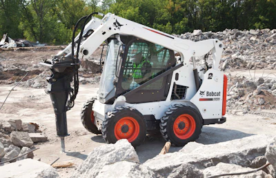 Most manufacturers offer special attachment kits. This Bobcat S570 is equipped with a hydraulic breaker attachment and enclosed cab to protect the operator from debris.