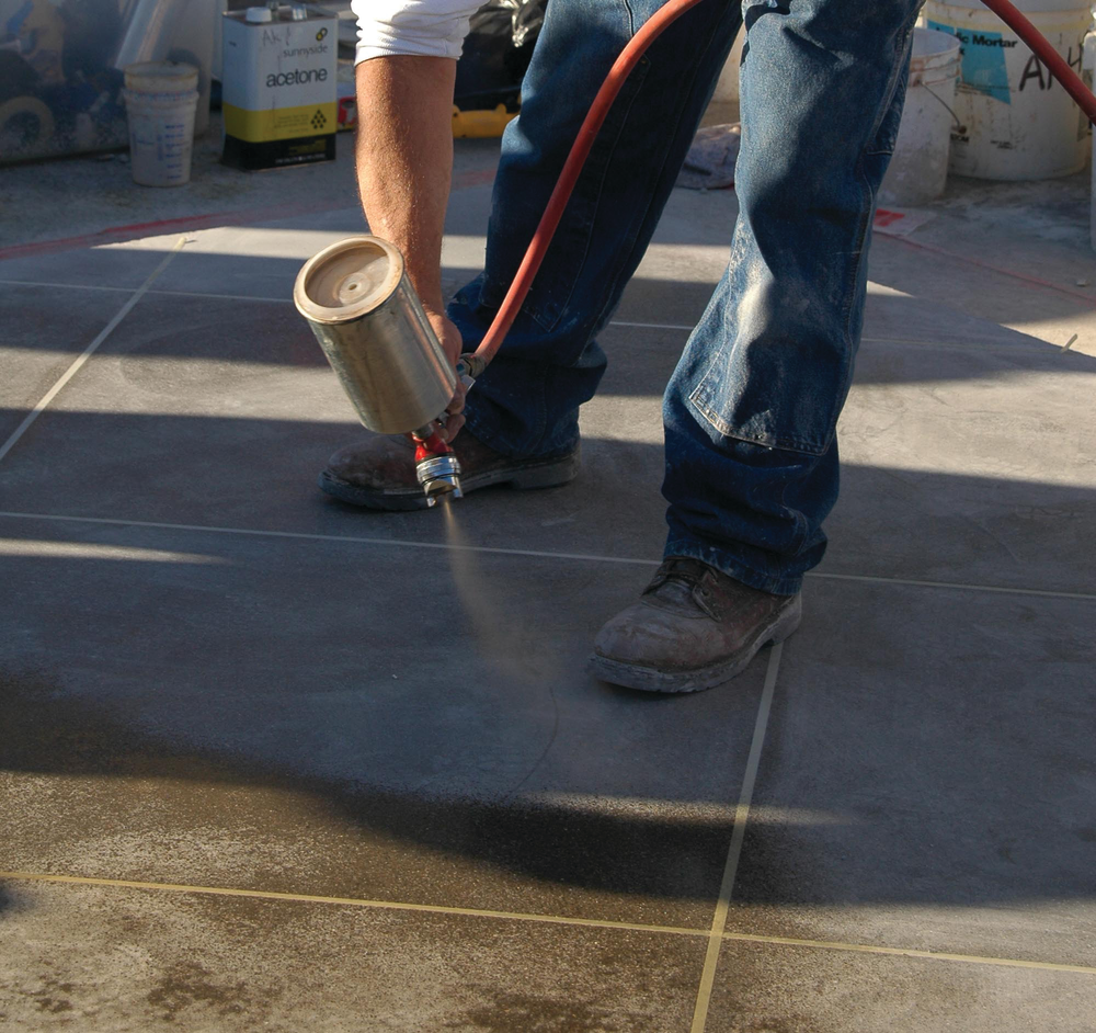 Dye dissolved in acetone solvent is being applied. Acetone is an especially risky solvent to use because of the risk it poses for fire and explosion. That said, it does a great job with dye stain applications and dries almost instantly.