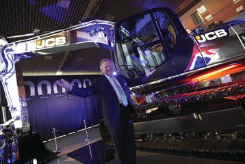 JCB Chairman Sir Anthony Bamford pictured with the one millionth machine produced by the company.
