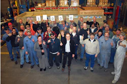 Johnson Crushers International Inc. employees celebrate the shipment of its 3,000th screen.