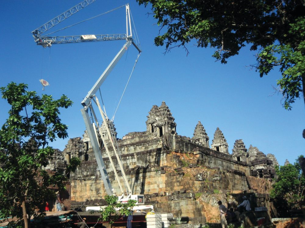 A Terex CBR 24 Plus self-erecting tower crane is lifting stone blocks and other materials up to a maximum of two tons or up to its maximum radius of 78 feet.