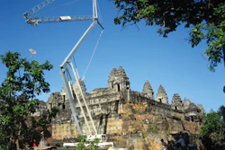 A Terex CBR 24 Plus self-erecting tower crane is lifting stone blocks and other materials up to a maximum of two tons or up to its maximum radius of 78 feet.