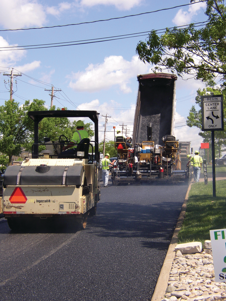 The key to compaction success after the mix has been placed is to roll the mat while it is still hot, so it's important the roller follow close behind the paver.