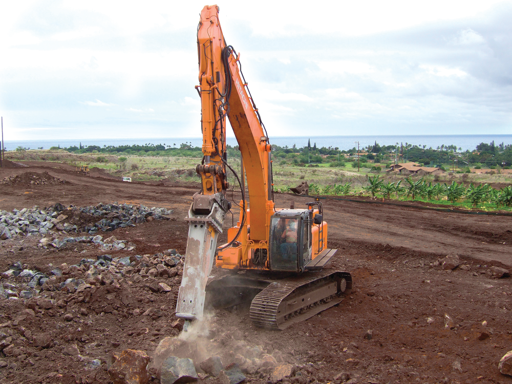 Blasting was not called for in the bid specs. Excavators equipped with rippers and hammers got the job done.