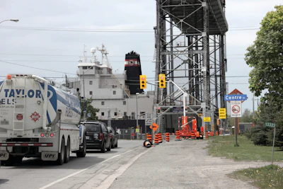 Two sets of portable traffic signals had to work in conjunction with the bridge's existing traffic control system to keep road traffic flowing during shipping season.