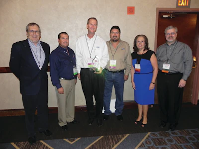 T.A.S. Commercial Concrete Construction is a Burr Bennett Winner is the Specialty Contractor category. Left to right: Mike Poppoff, president, ASCC; Edwin Villarreal, Tim Manherz, and Hector Valenzuela, T.A.S. Commercial Concrete; and Helen Prince and Wayne Kirkland, CNA.