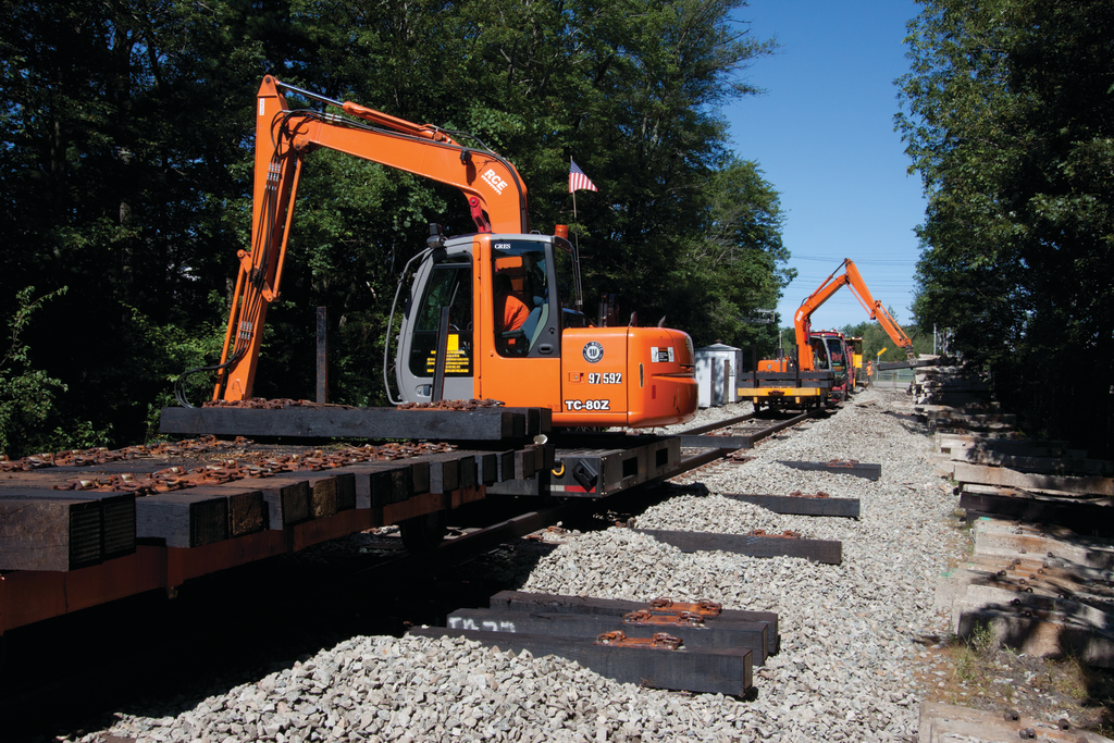 Hitachi ZX80 excavators with special attachments were mounted to high-rail bases in order to remove the old ties during rebuilding of Boston's commuter rail.